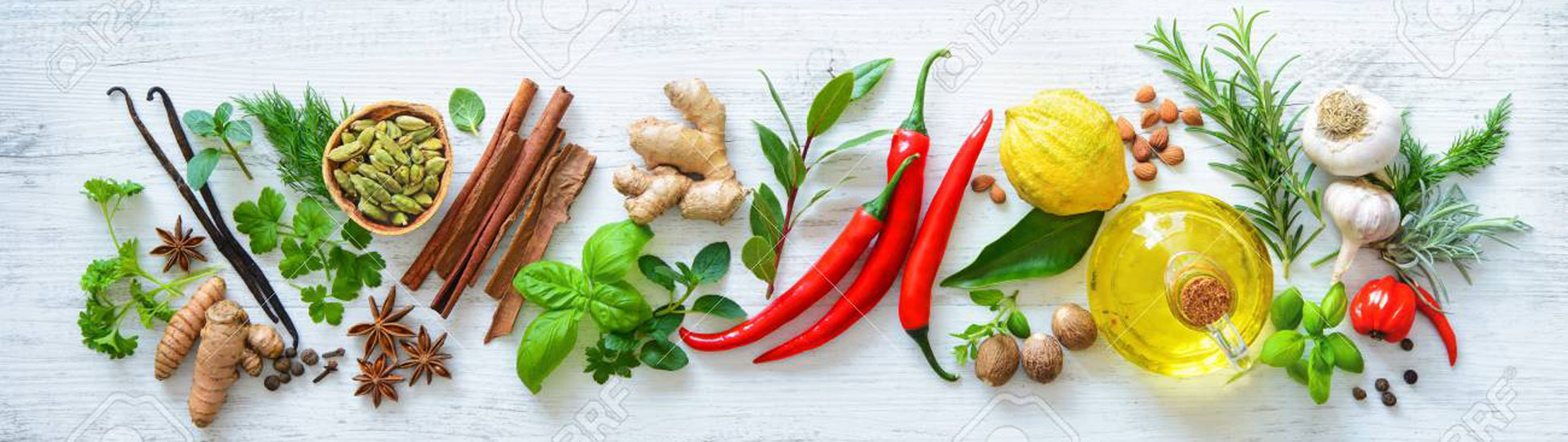 99230337-fresh-aromatic-herbs-and-spices-for-cooking-on-wooden-board